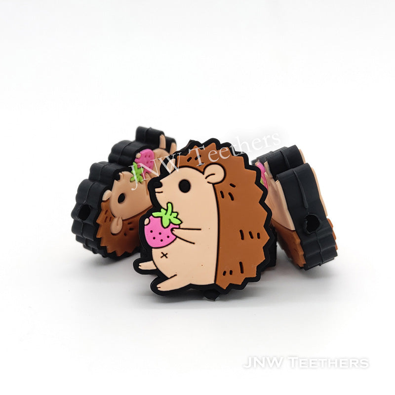 Holding strawberry hedgehog silicone focal beads