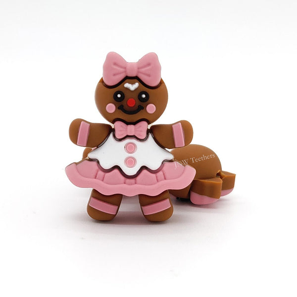 JNWTeethers 3D Gingerbread girl silicone focal bead with a pink bow and dress