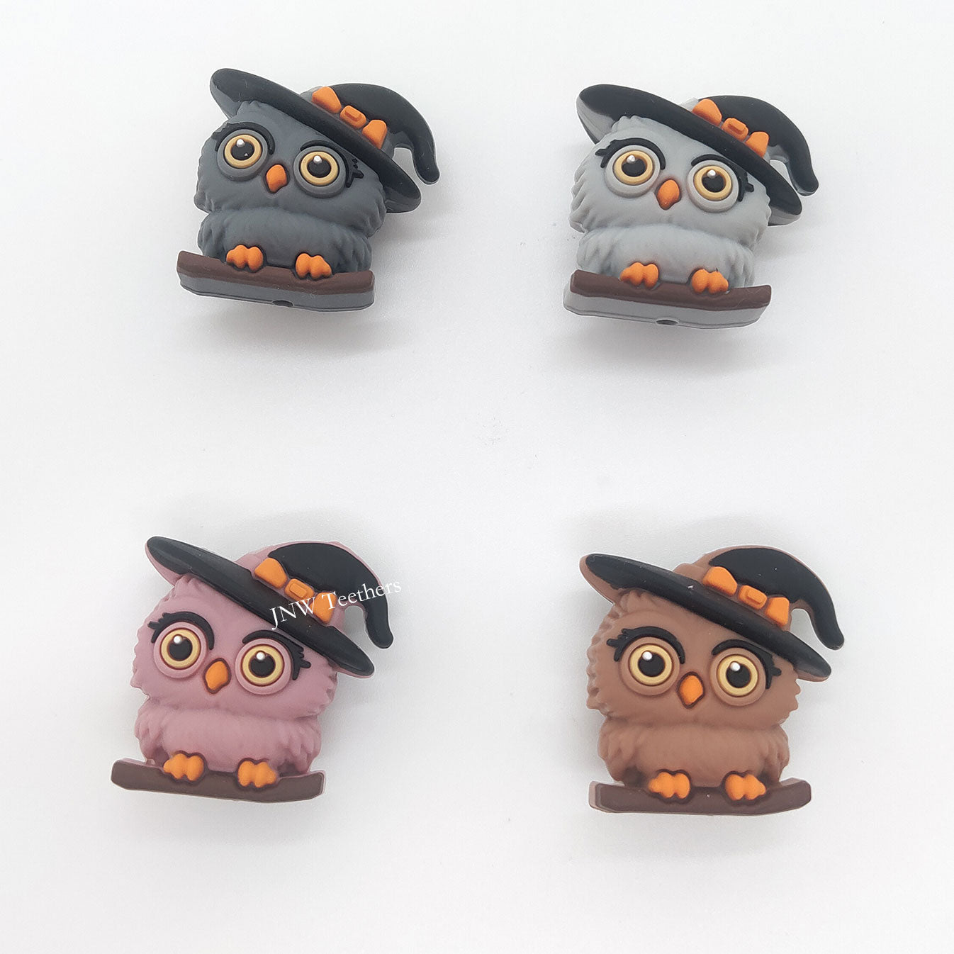 3D witch owl silicone focal bead wearing a black-and-orange witch hat while perched on a branch