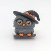 Dim gray 3D witch owl silicone focal bead wearing a black-and-orange witch hat while perched on a branch