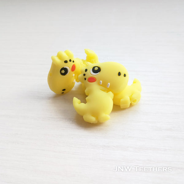 Dino silicone focal beads yellow