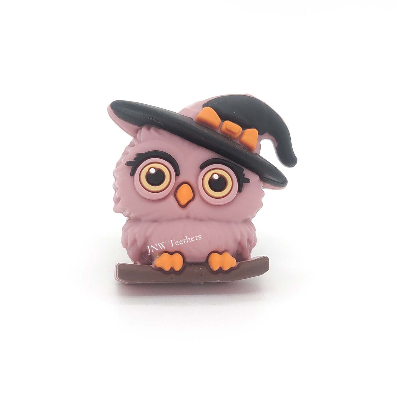 Dusty rose 3D witch owl silicone focal bead wearing a black-and-orange witch hat while perched on a branch