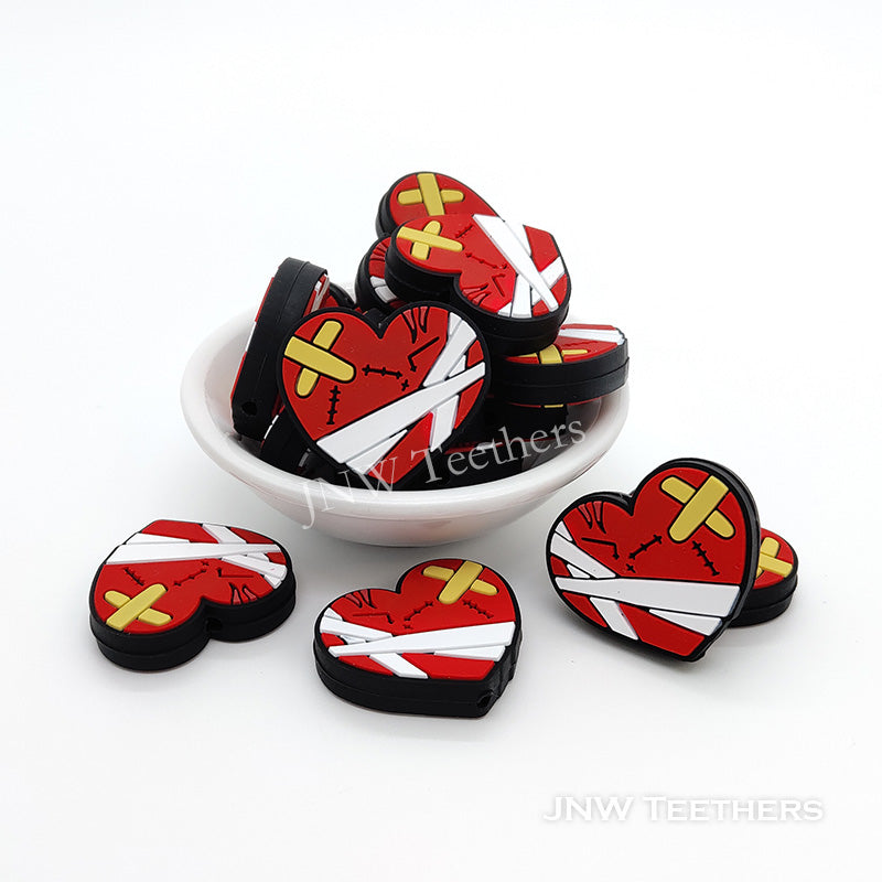 The red broken heart silicone focal beads